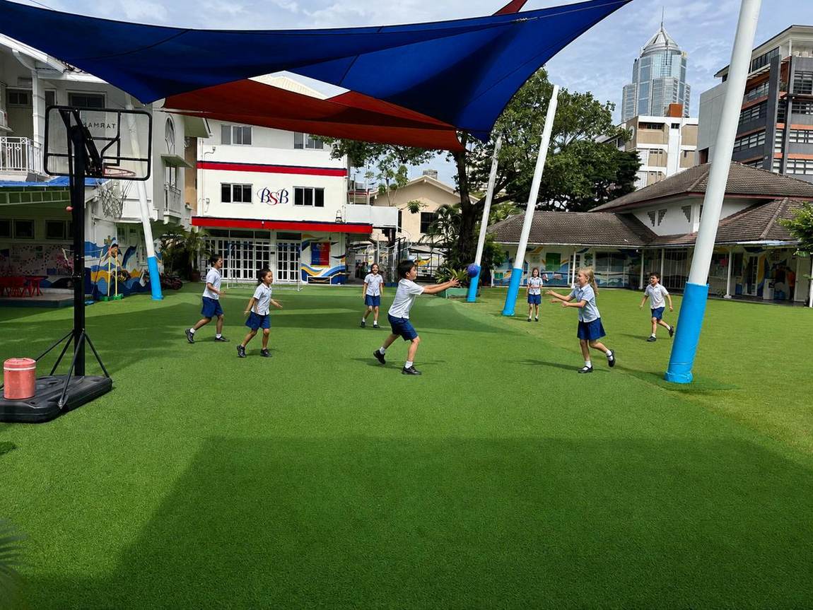 Students playing a team ball game together on the playground