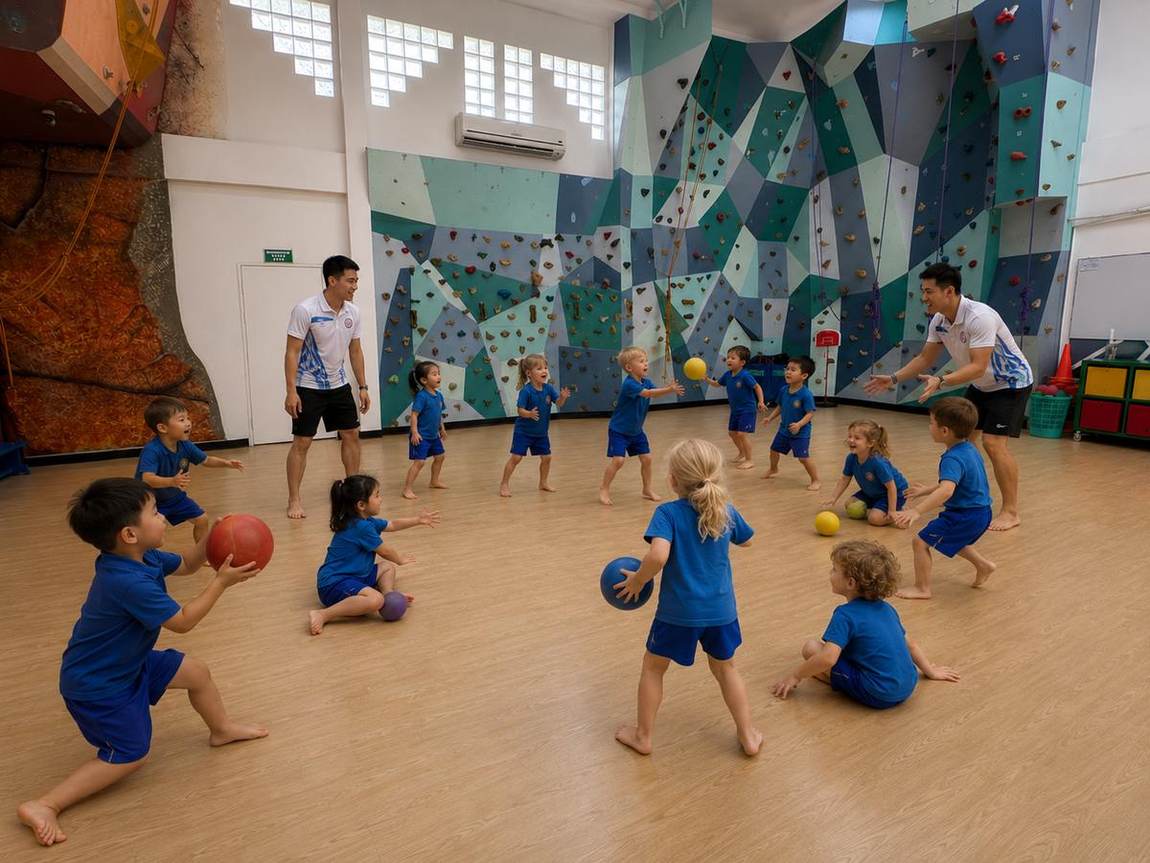 Young students playing a ball game with coaches in the sports hall