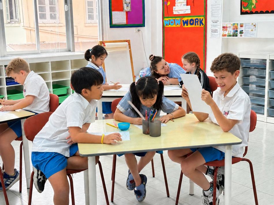 Students sitting on the carpet during a whole-class lesson