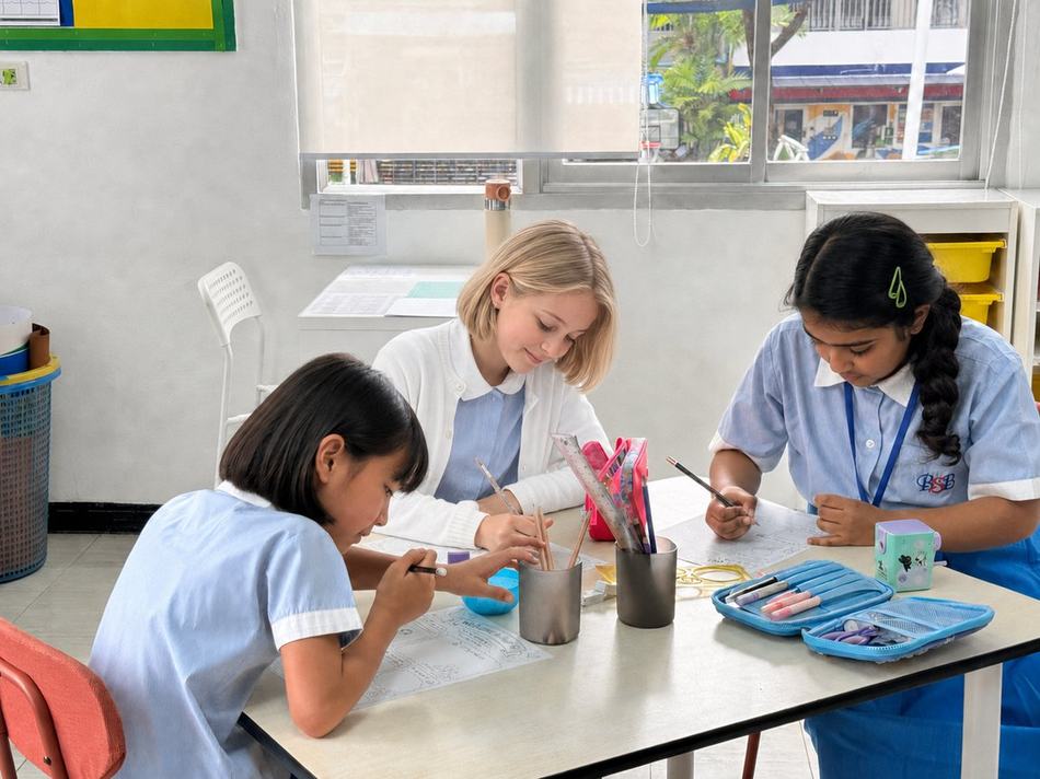 Students working together on worksheets at a table