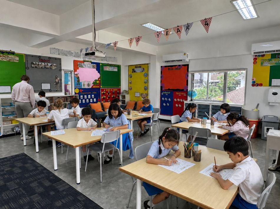 Year 4 students working at their desks around the classroom