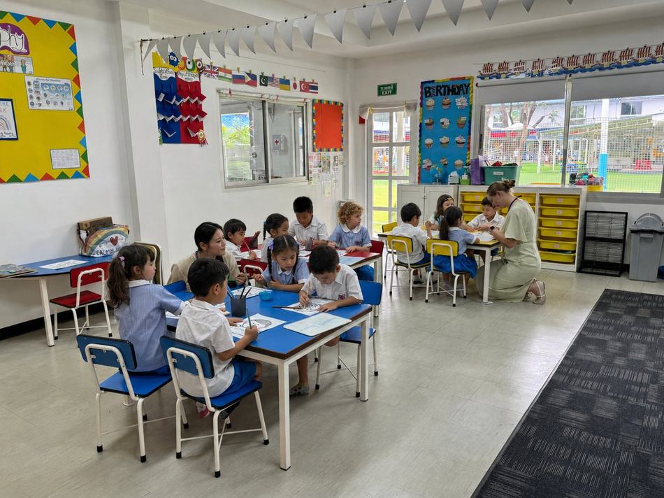 A group of students working together at their desk