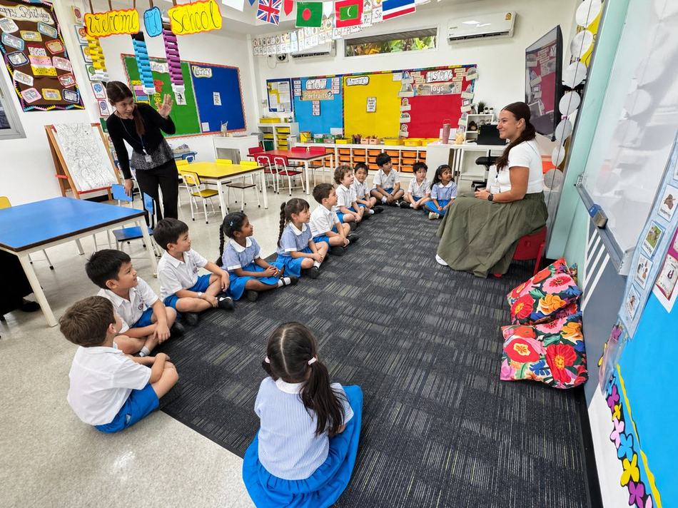 A teacher welcoming students during morning circle time