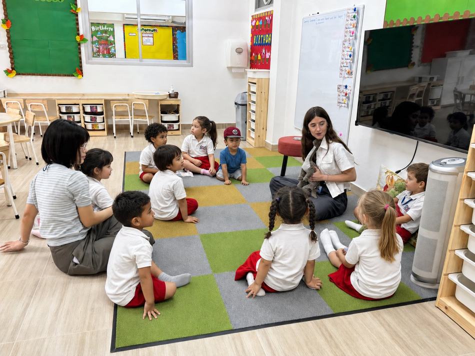 Early Years students during puppet storytime with their teacher