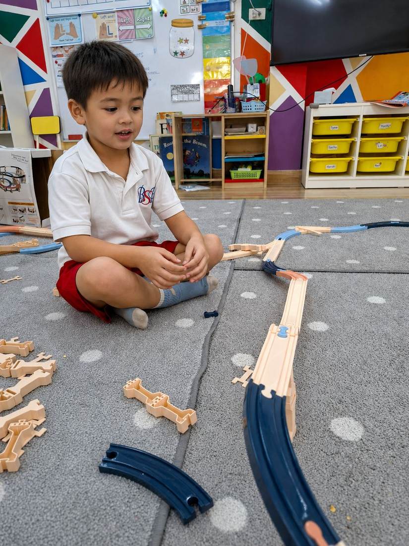 A student showing off their construction during Building Club