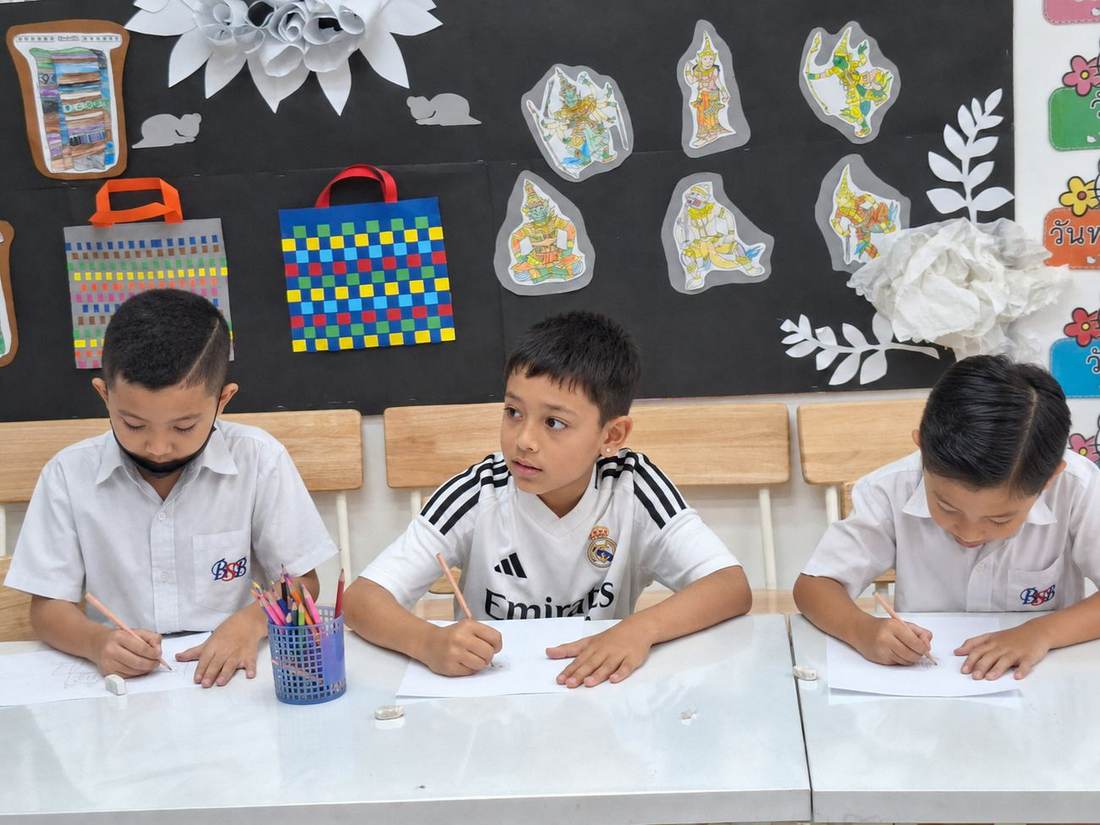 A student sketching a cartoon character during Cartoon Drawing Club