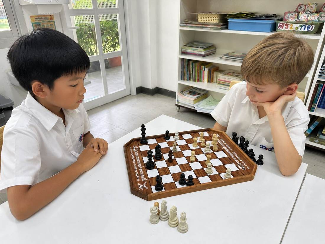 Students playing chess during Chess Club