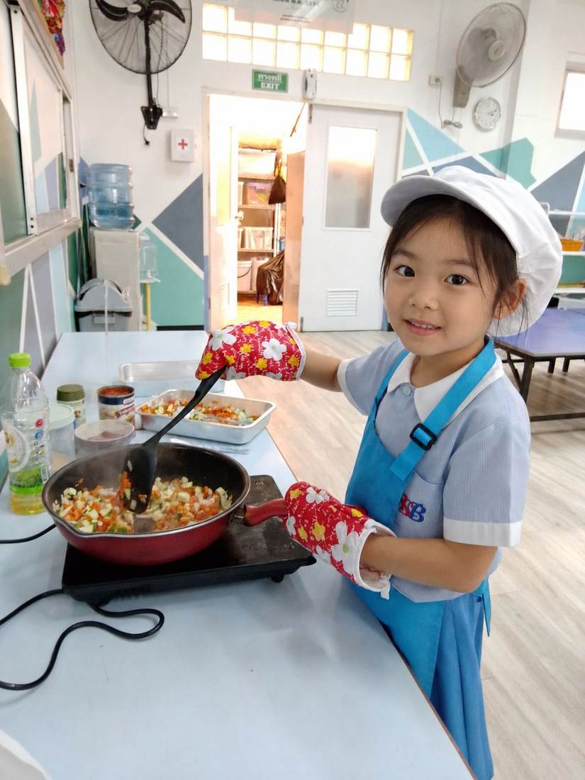 Students decorating their dishes during Cooking Club