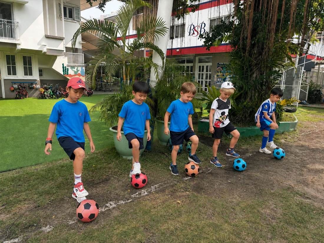 Students on the pitch during Football Club