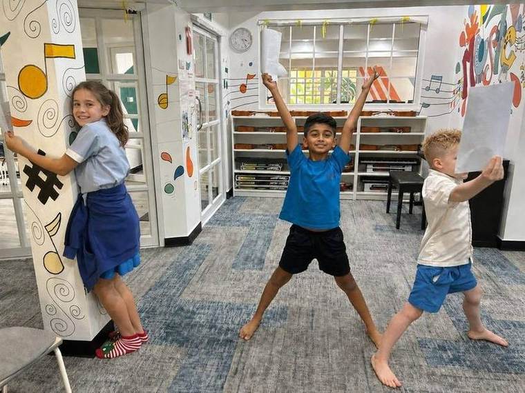 Students striking a pose together during Musical Theatre