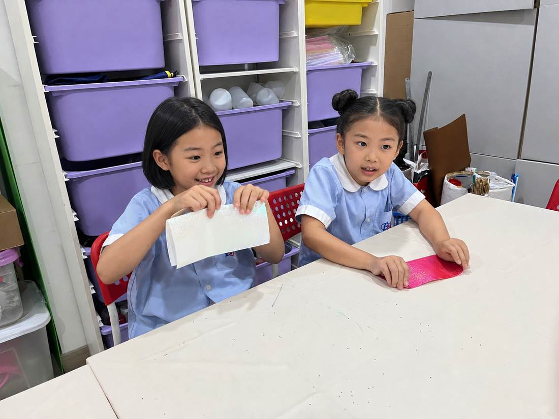 Students with their finished paper crafts during Origami