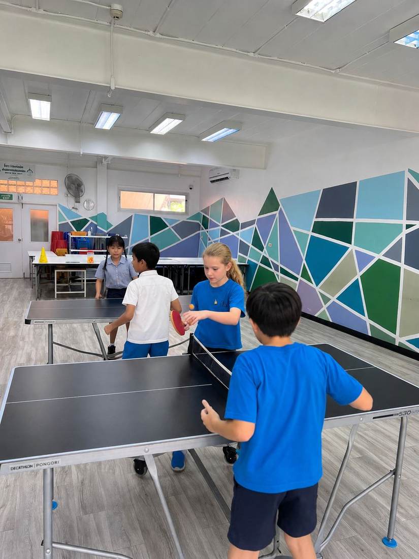Students rallying at the table during Table Tennis Club