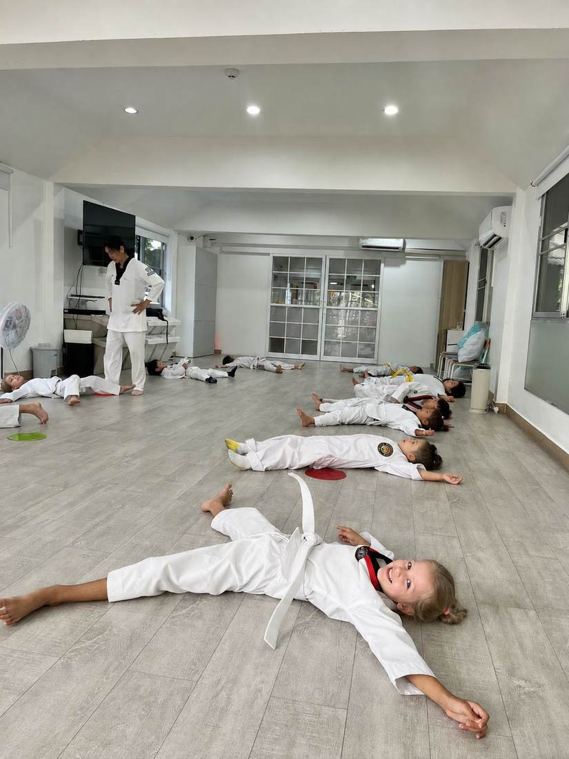 Students training with their instructor during Taekwondo