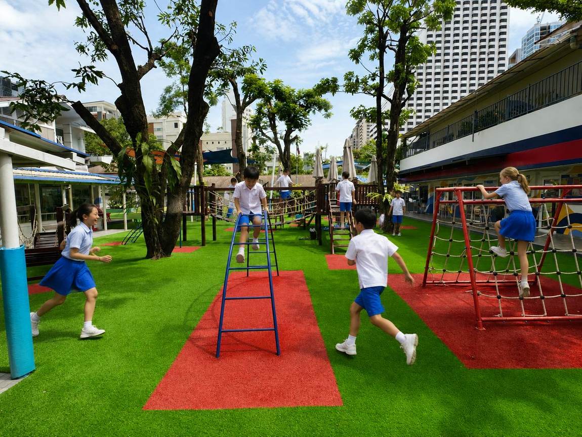 Students racing and climbing on the playground climbing frame