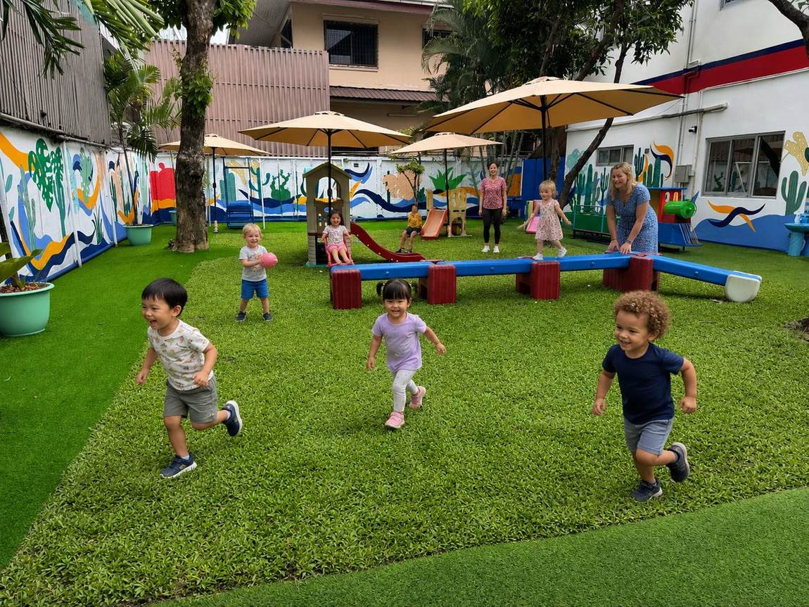 Students playing on the soft-play equipment in the playground