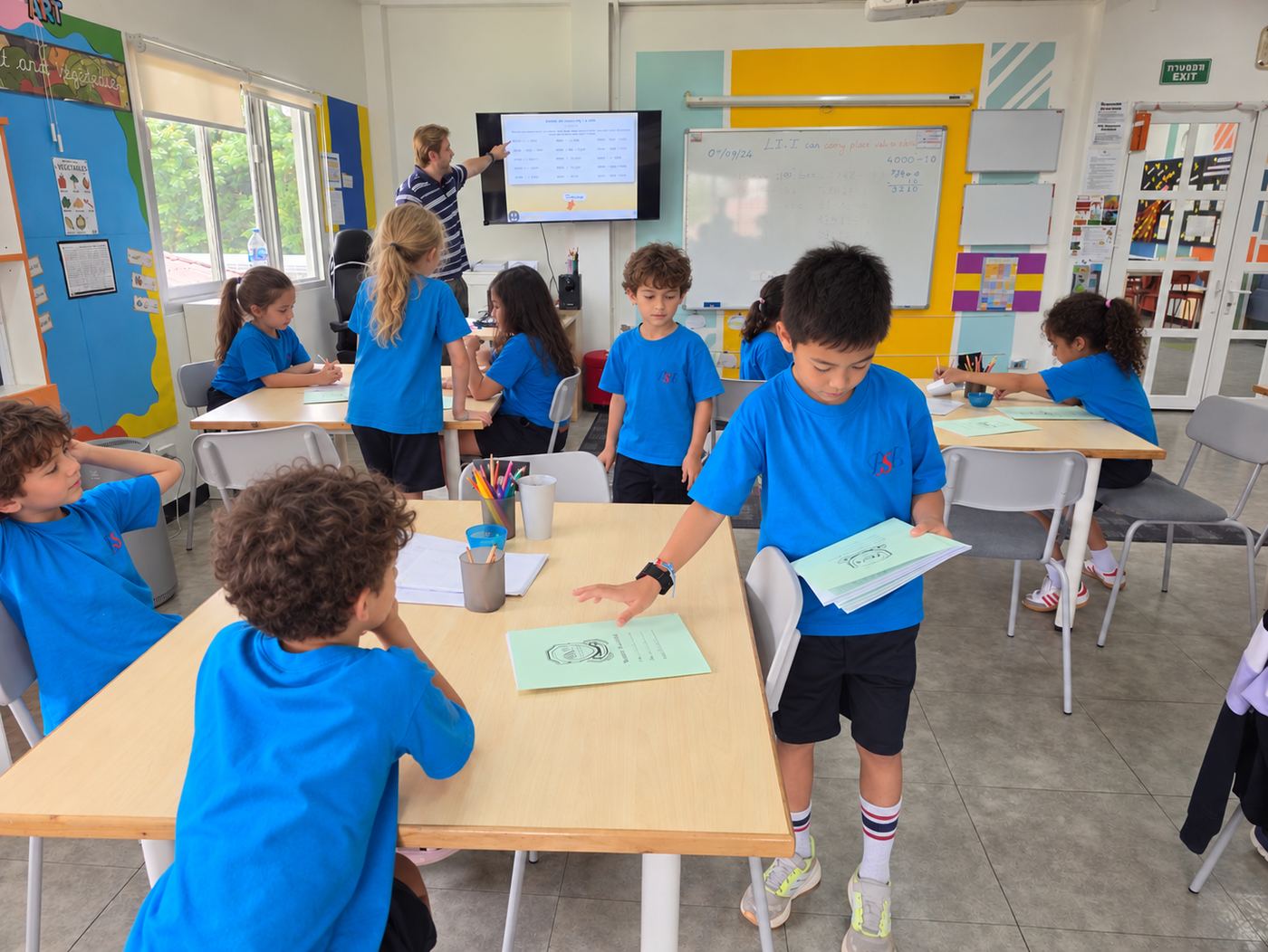 Students taking on classroom responsibility roles together
