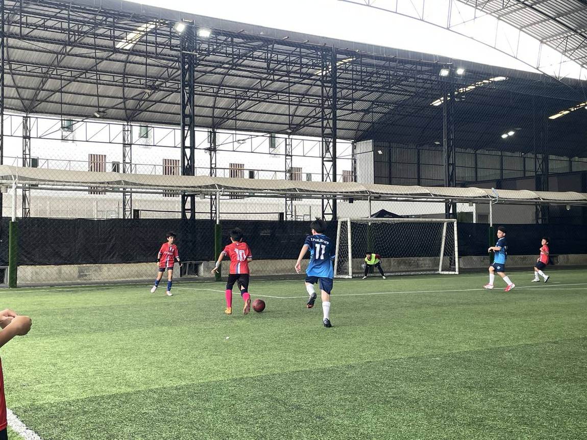 Students playing in the indoor football competition