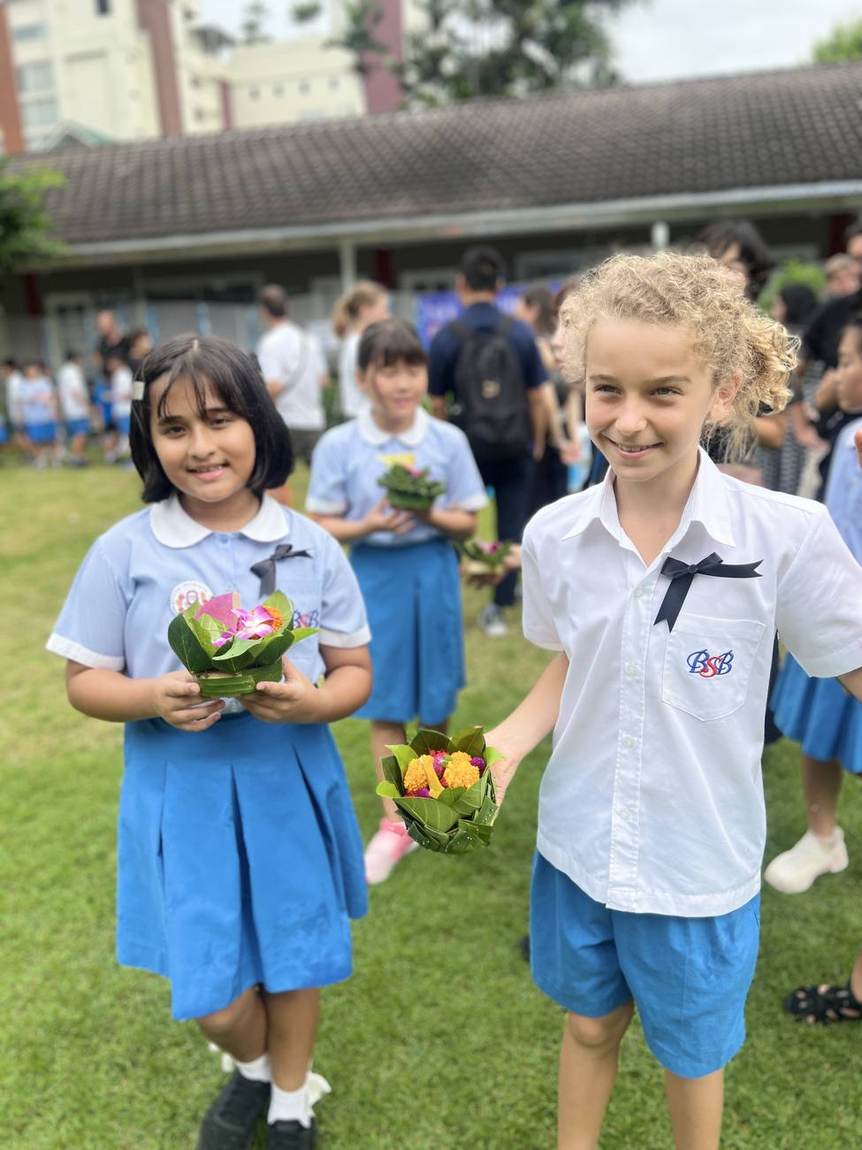 Students gathered around the pool for the Loy Krathong Day celebration