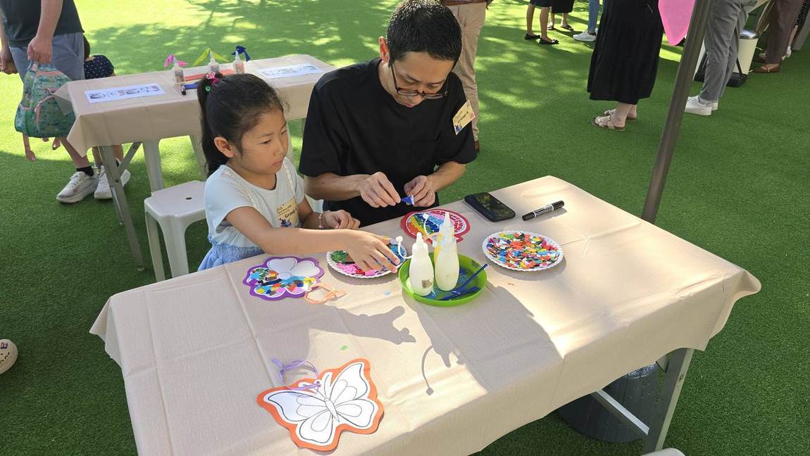 A student playing a musical instrument activity at Open Day