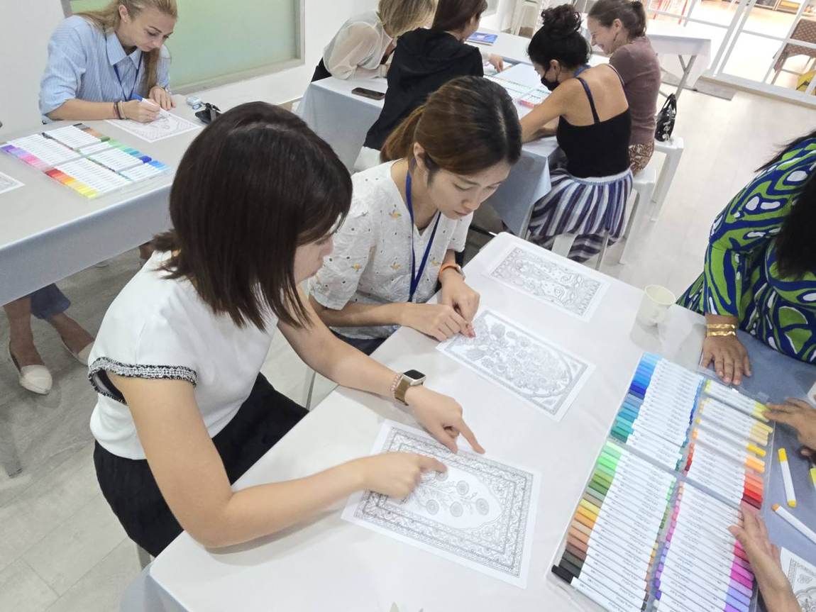 Parents and staff working together at the Parents' Art Workshop