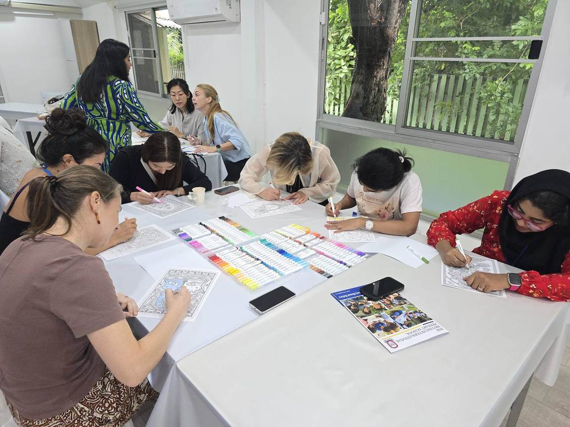 Colouring materials and artwork at the Parents' Art Workshop