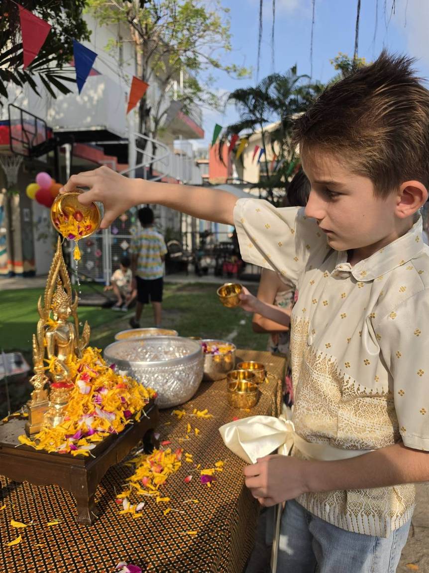 Students playing with water during the Songkran celebration