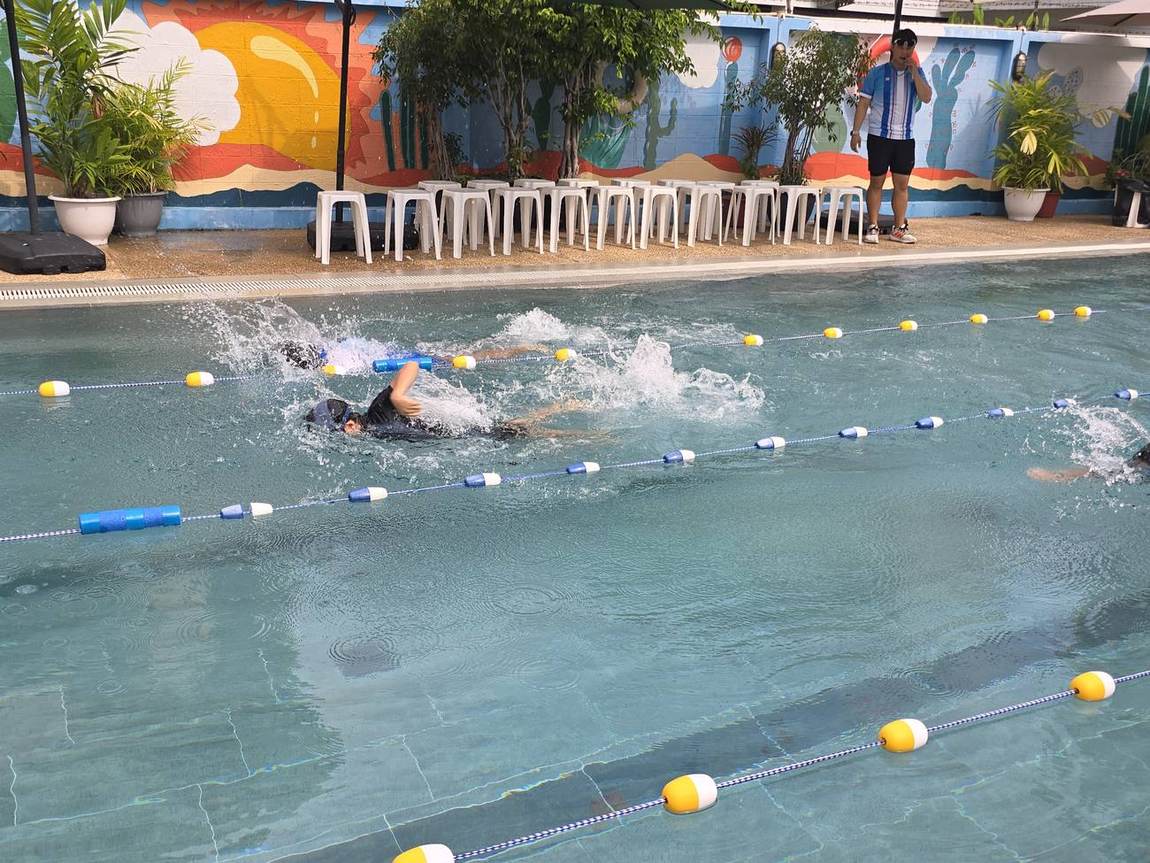 A student swimming during the competition