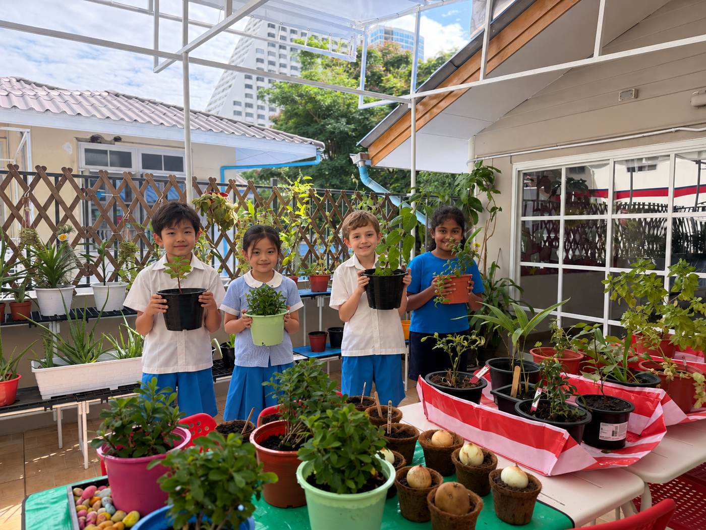 Global Ambassadors caring for plants as part of a community project