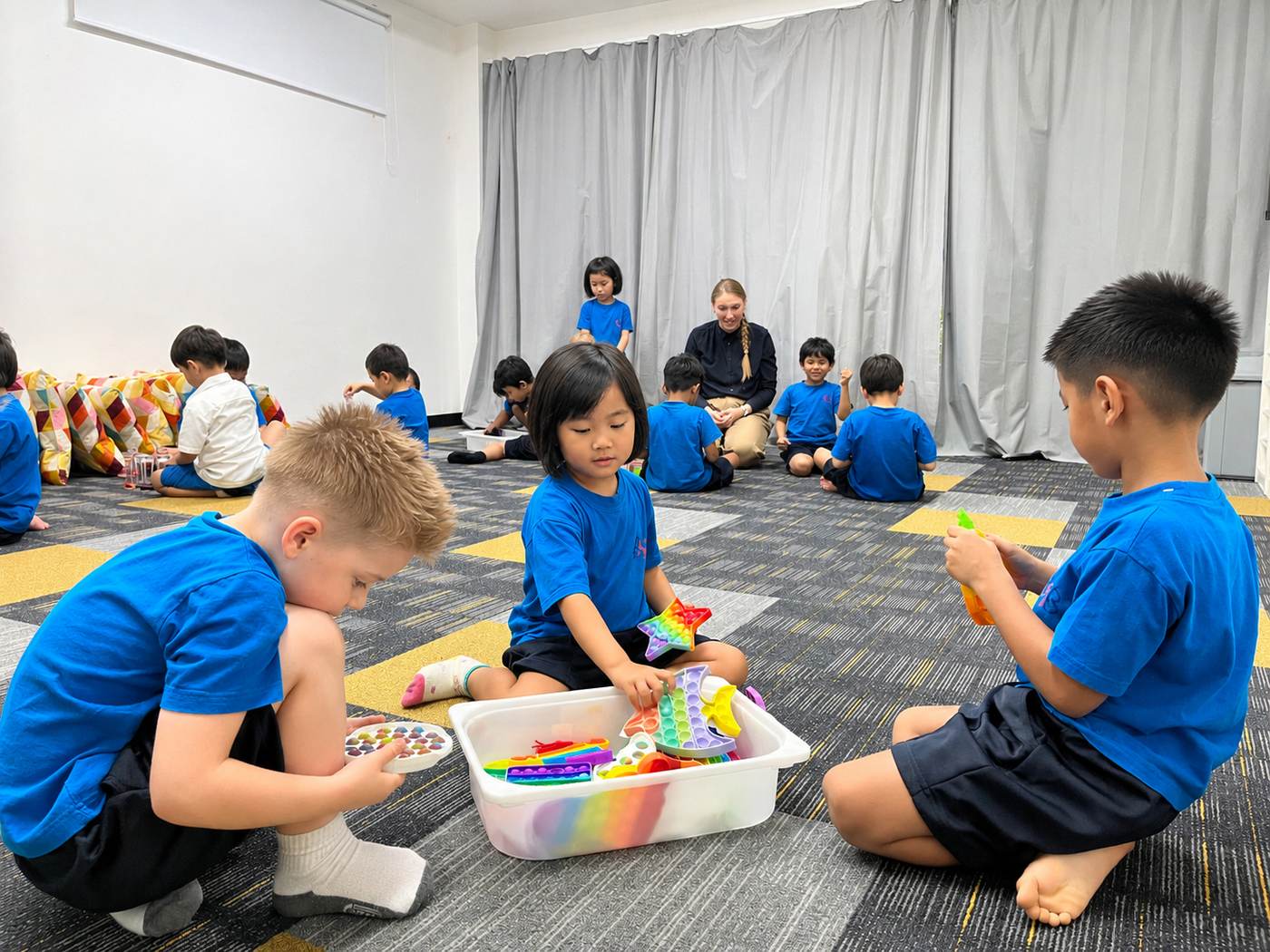 Students exploring sensory toys together in the Multi-Sensory Room