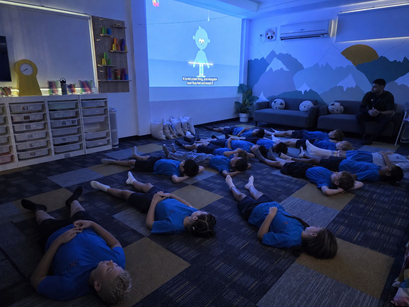 Students relaxing during a guided calming and breathing session