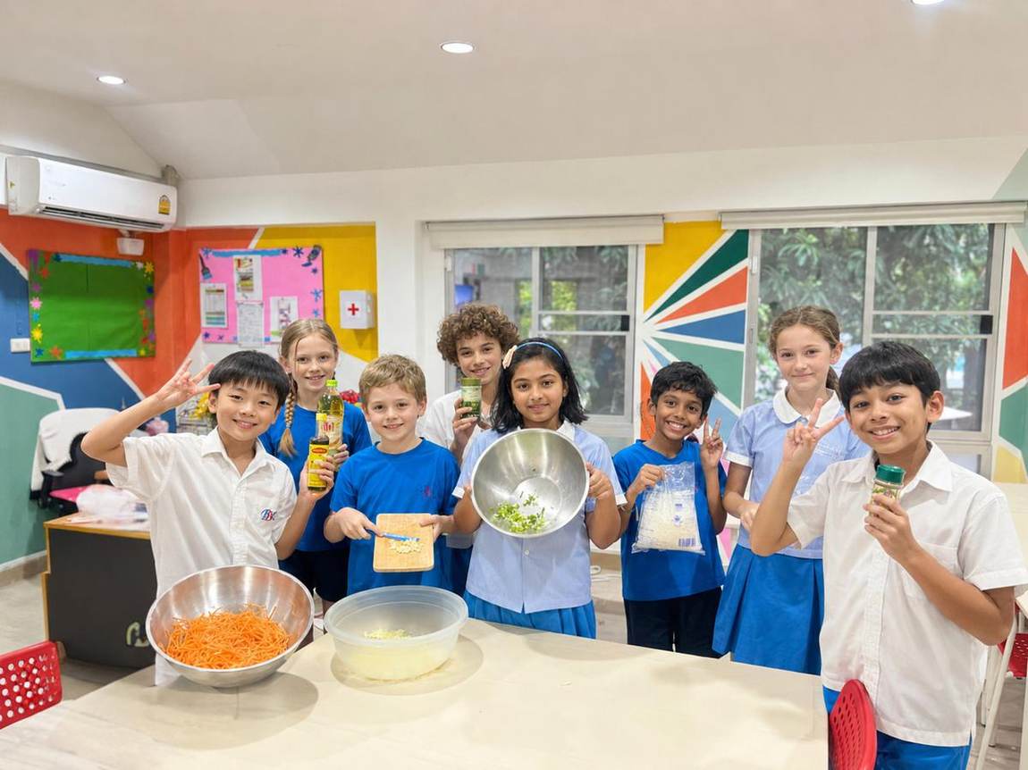 Students holding up their baking together as a group