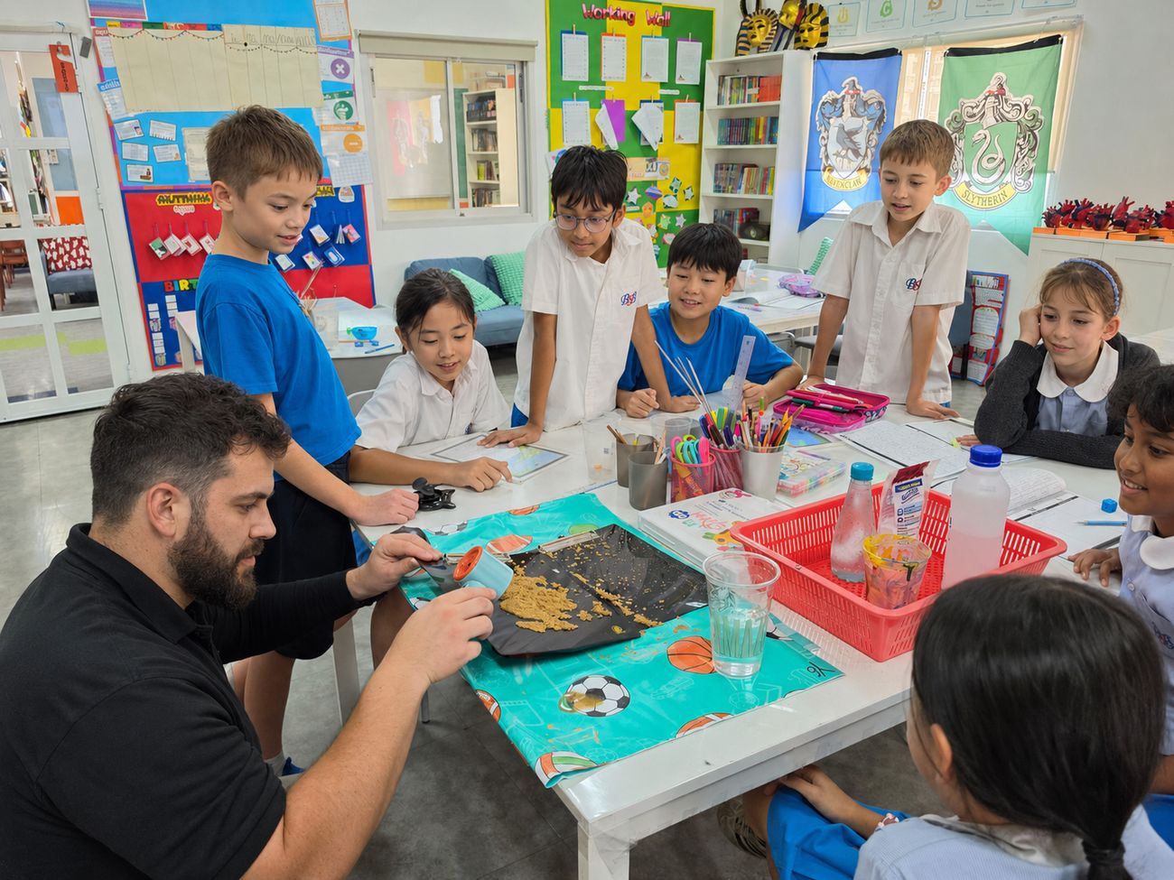 Key Stage 2 students taking part in a hands-on activity with their teacher