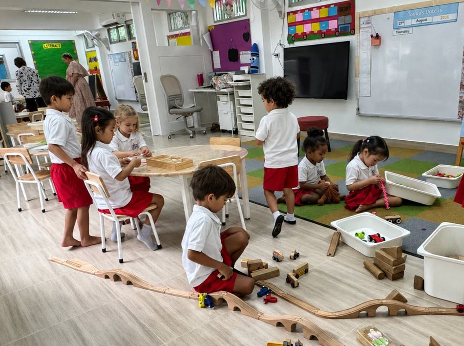 Students playing together with blocks and toys in the classroom