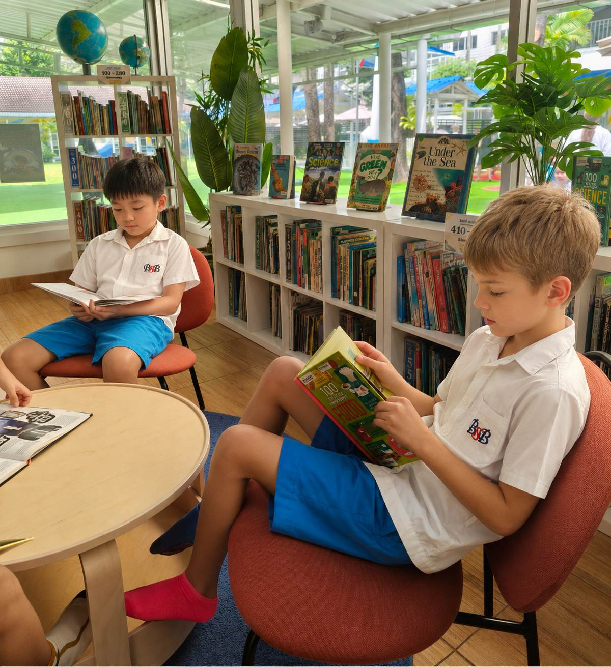 Students reading together at a round table in the library