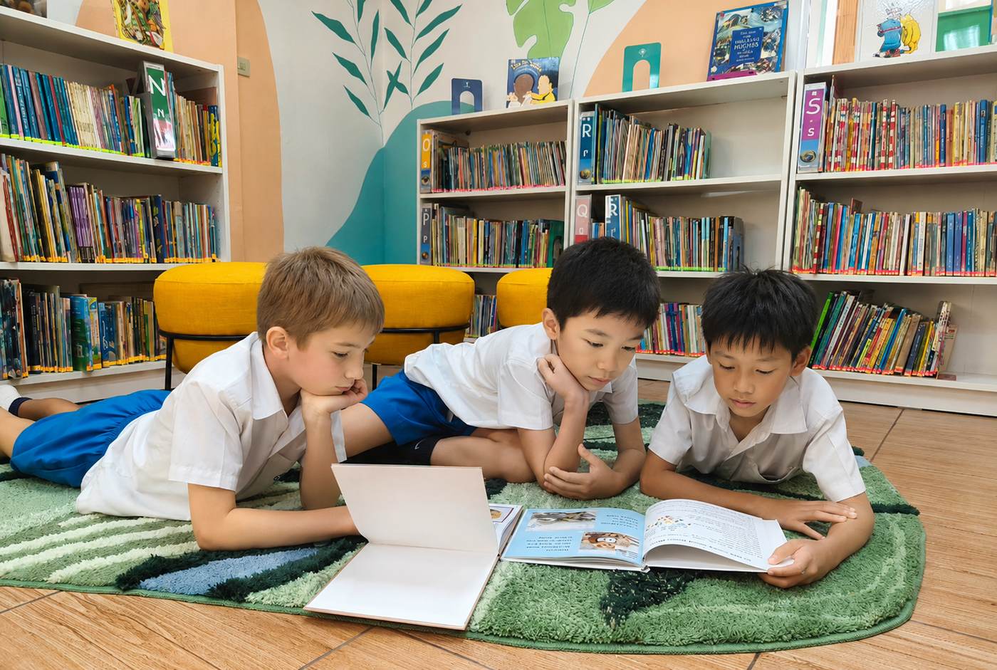 Students reading together on the library rug